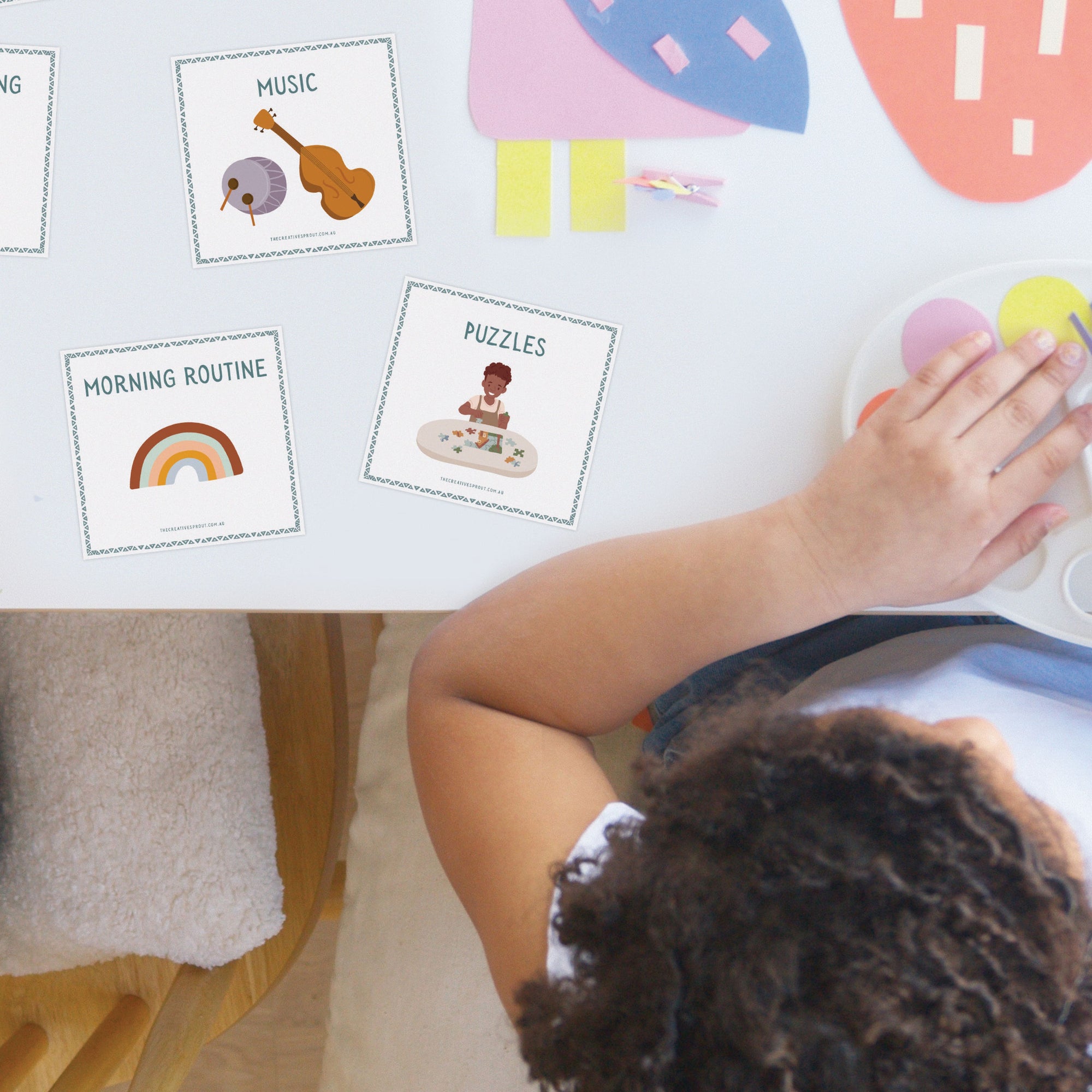 child in classroom with morning routine cards