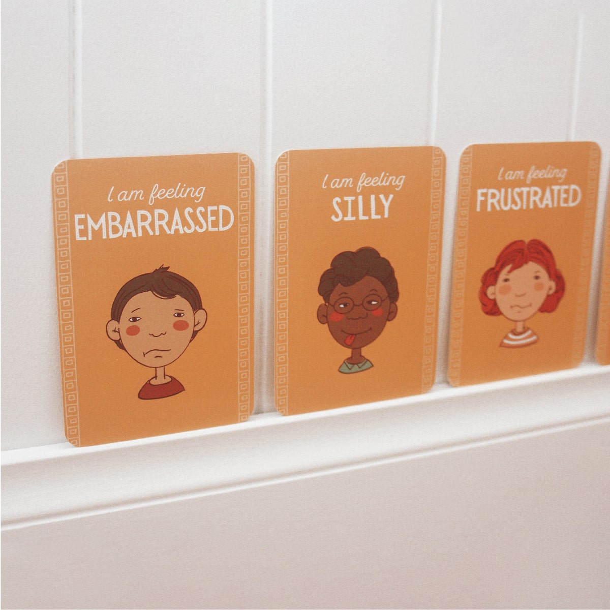 emotions activities for toddlers - set of cards hung on wall