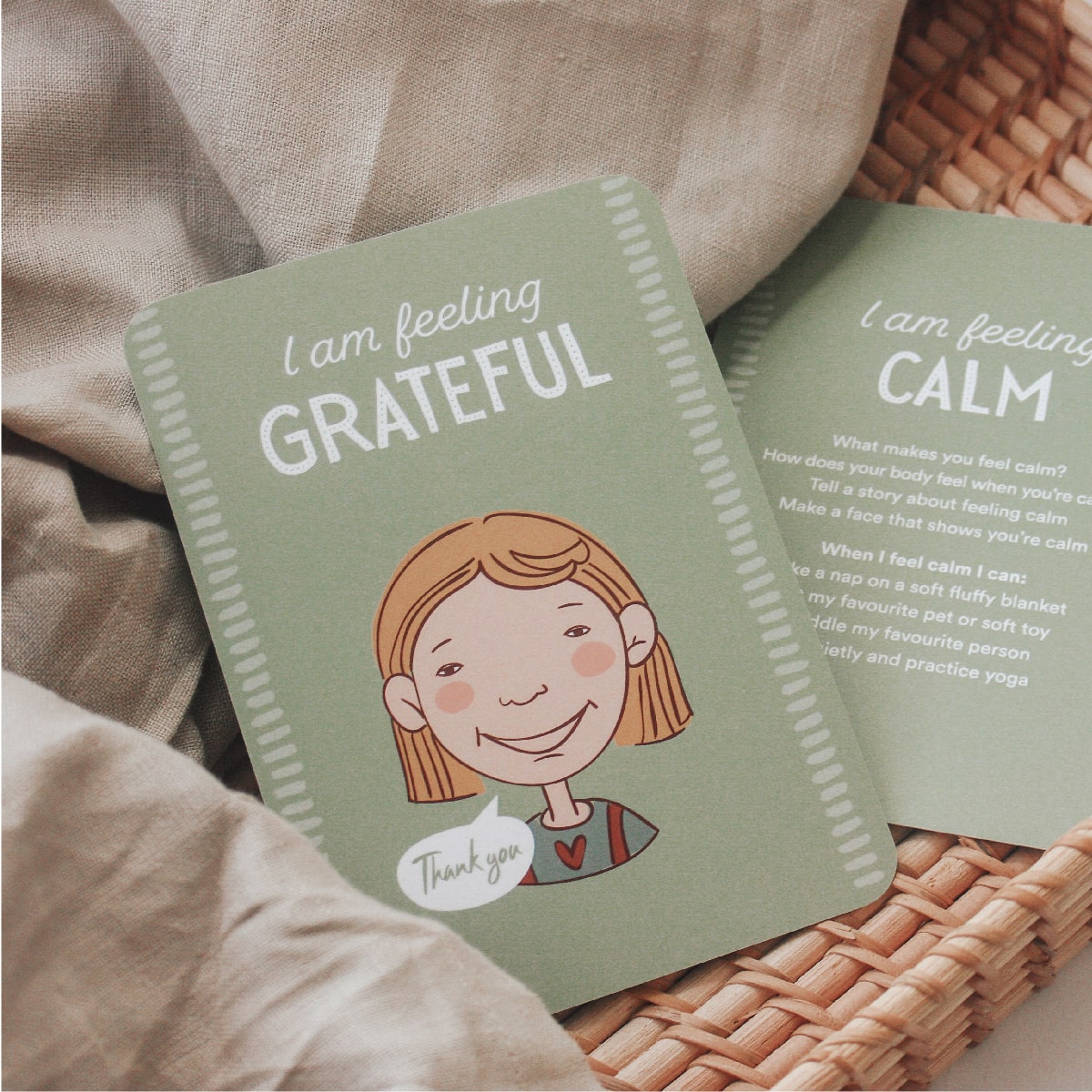 emotions cards for kids, sitting on blanket in calm corner