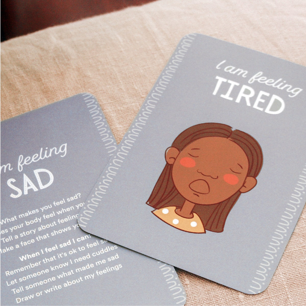 feelings books for toddlers on pillow in calm down corner