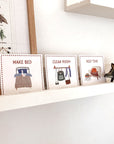 shelf with montessori toys, visual schedule and educational poster