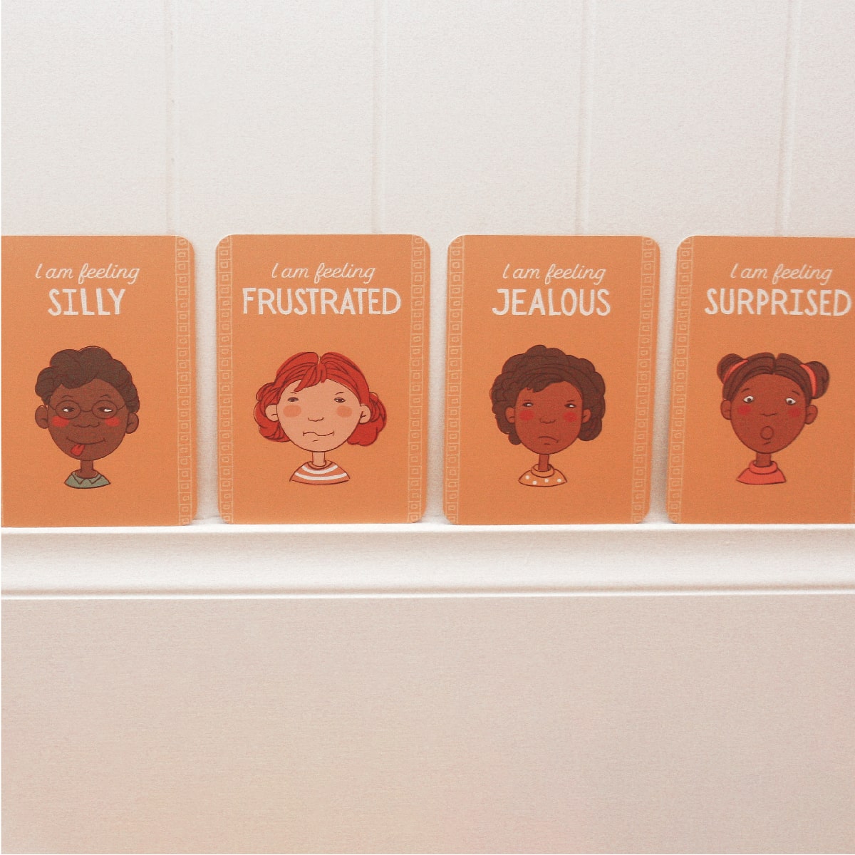 emotional intelligence emotions cards for kids, in bedroom hung on wall